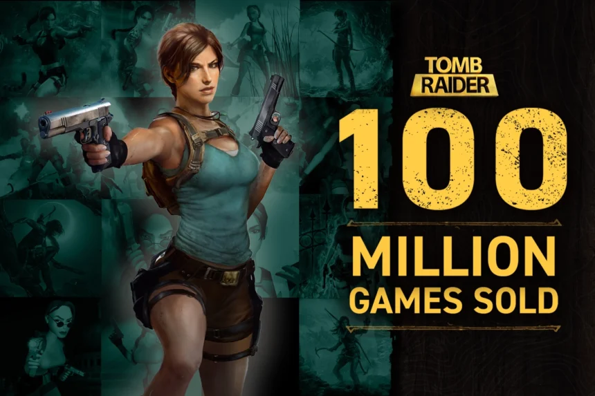 Lara Croft, protagonista di Tomb Raider, con le pistole in mano accanto al testo '100 Million Games Sold', celebrando il successo del franchise